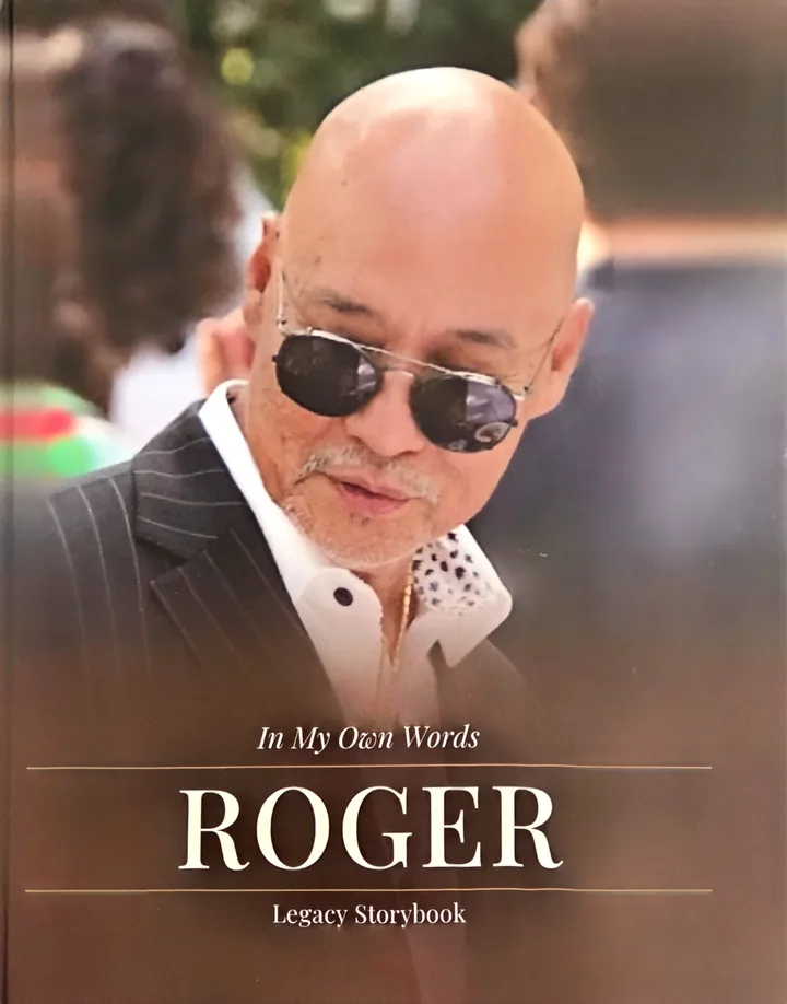Roger's book: In My Own Words, with his photograph on the cover.